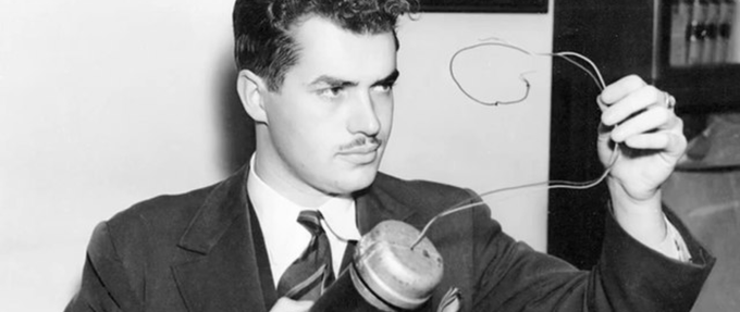 black and white photo of jack parsons holding a bomb
