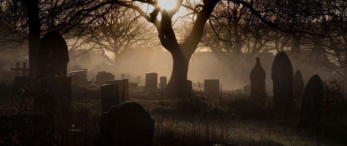 dark photo of a cemetery 