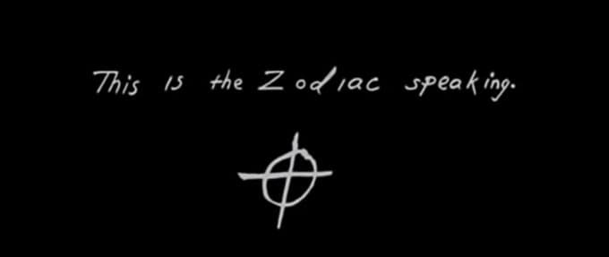 Black background of handwriting that says "This is the Zodiac speaking." 