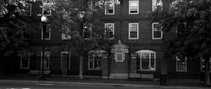 Black and white photo of Harvard; We Keep the Dead Close excerpt